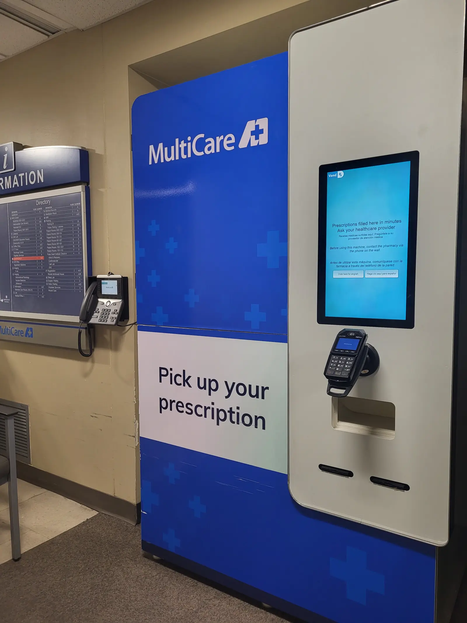 VendRx unit in MultiCare branding beside a hospital information desk